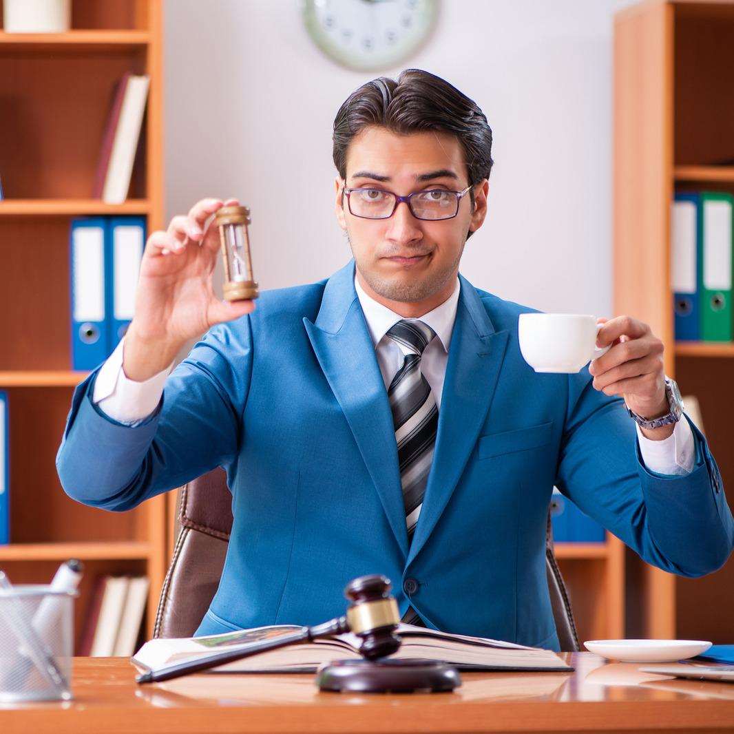 Lawyer Holding Hourglass and Tea